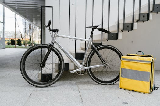 Gig economy apps. A bicycle with a delivery bag poised for service in a modern urban environment.