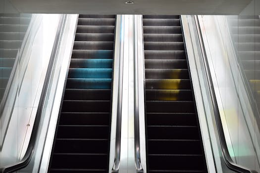 A close-up view of modern escalators in a sleek and minimalist interior setting.